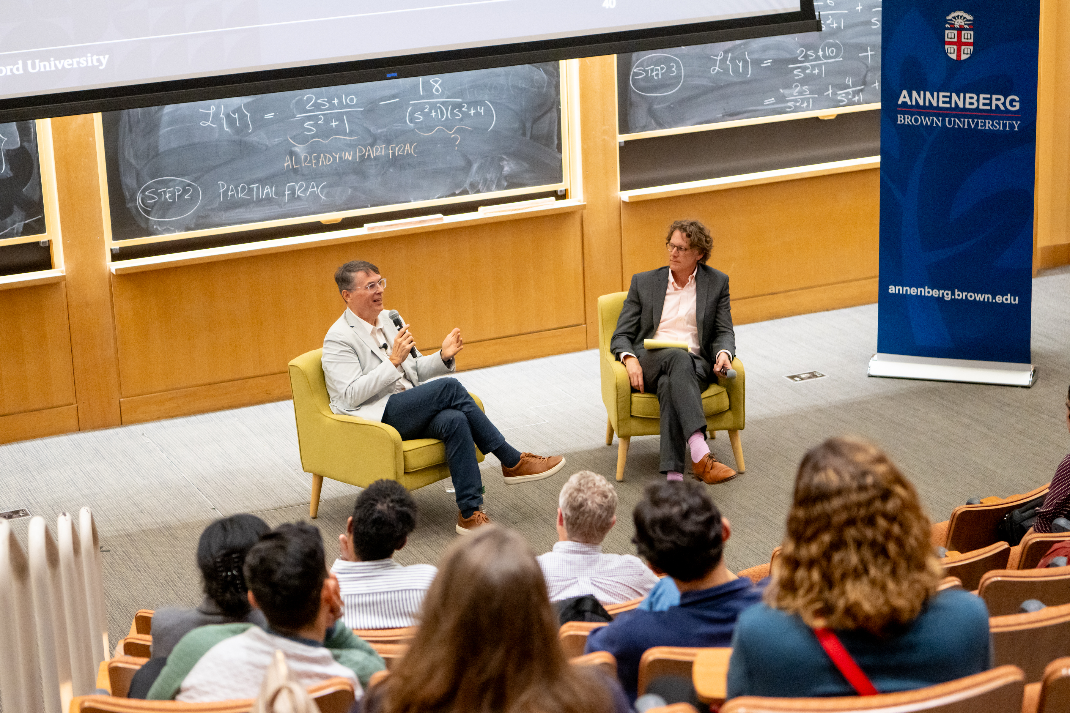 John Papay having a public discussion with Tom Dee