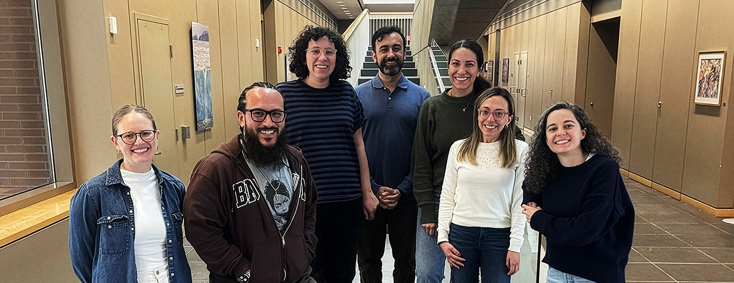A variety of students and post-graduates pose for a photo at Brown University