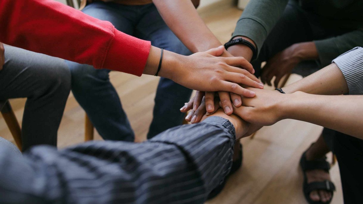 students joining hands