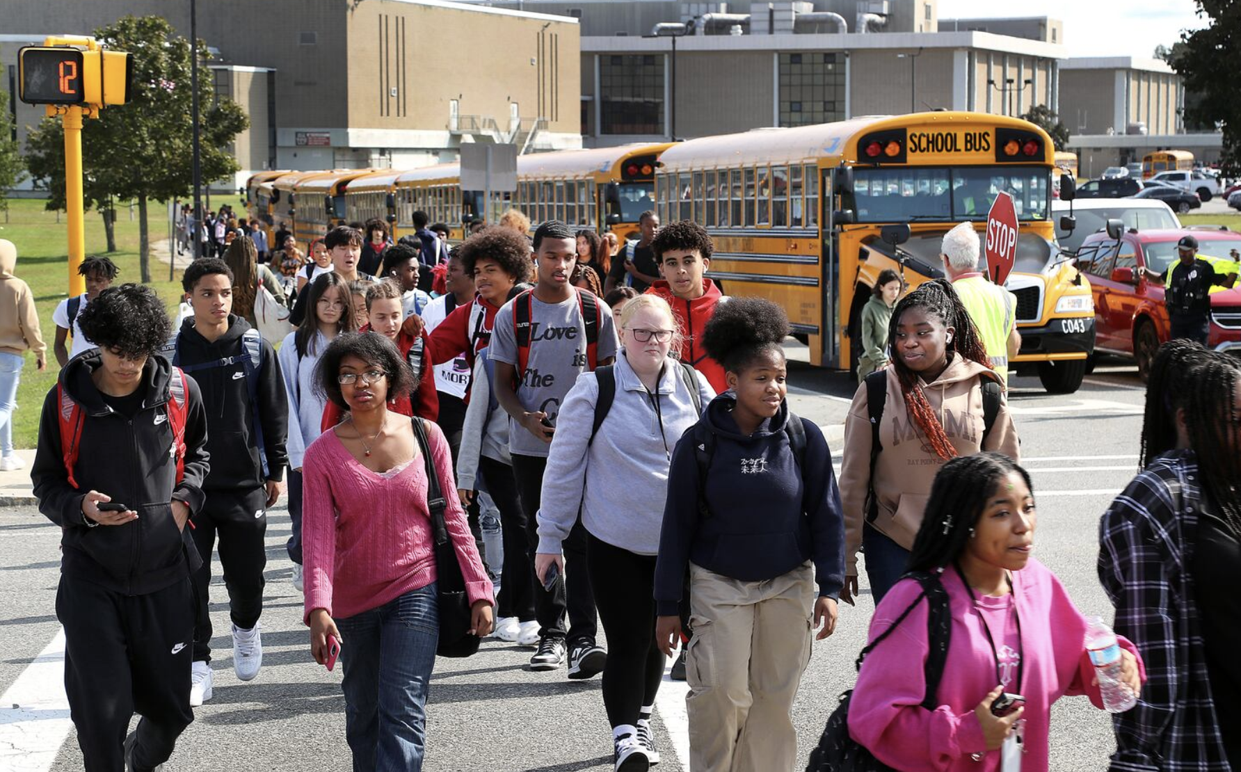 students by a bus