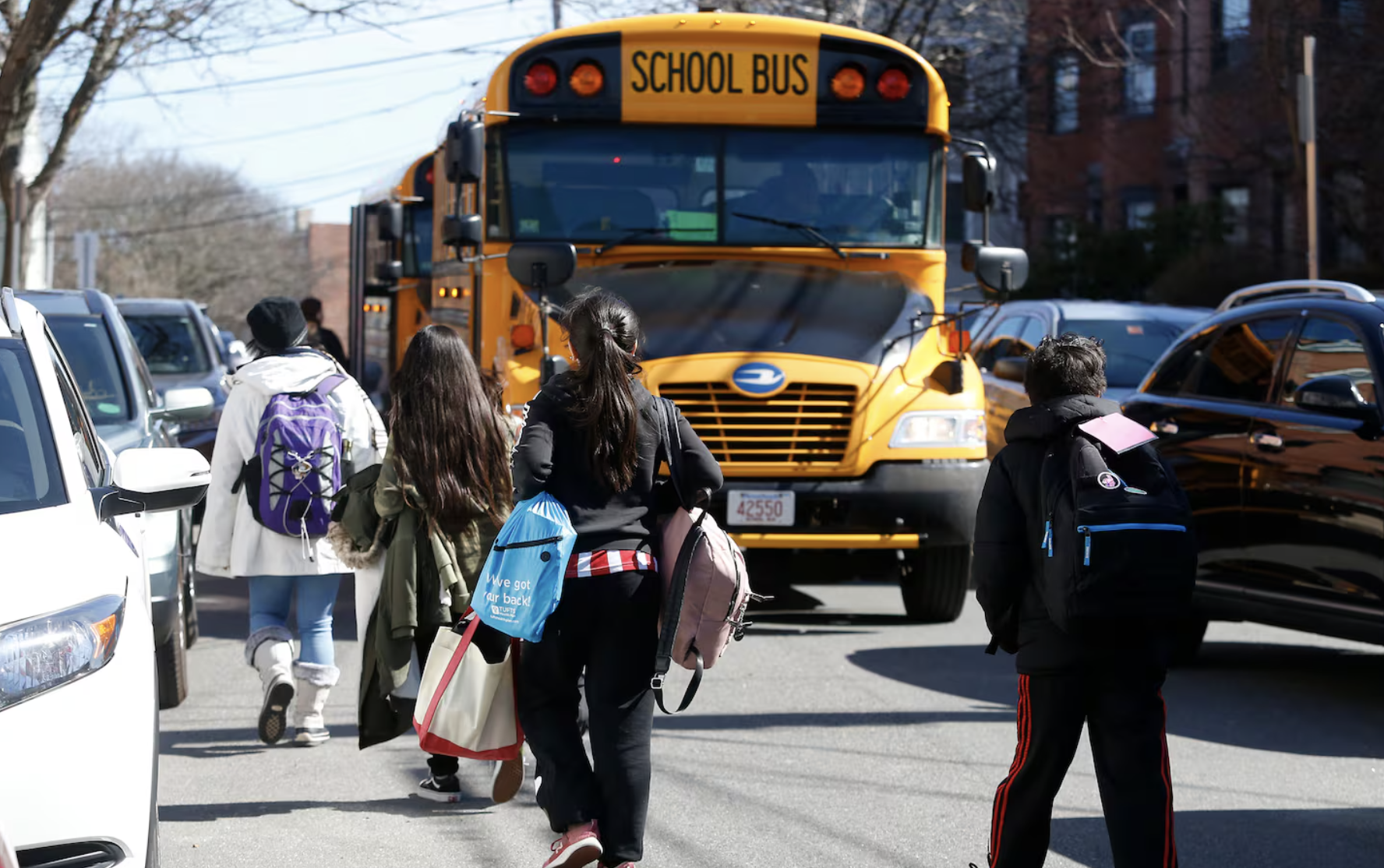 students walking to bus