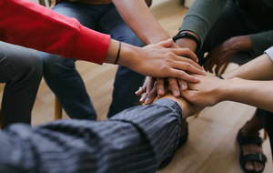students joining hands