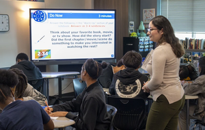 English teacher Jessica Gallo assists students during a writing exercise in her classroom at Dekaney High School in Houston, on Sept. 16, 2025. Newcomer immigrant students in high school with low English-proficiency face multiple barriers schools can address.
