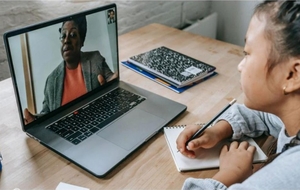 Student in a video tutoring session on a laptop