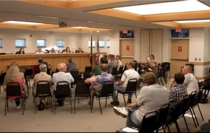 Audience at a school board meeting
