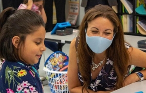 Tennessee Education Commissioner Penny Schwinn visits with a student